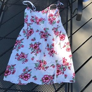 White dress with cranberry and green flowers